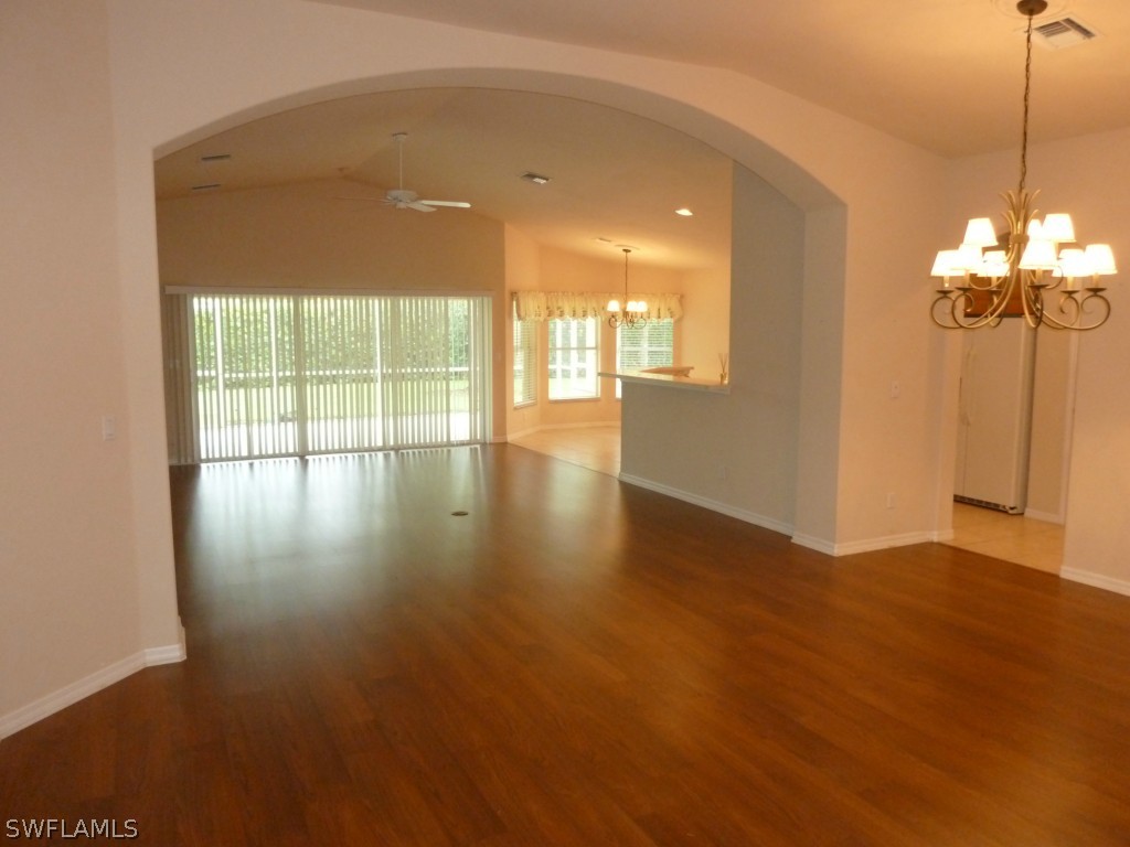19744 Villa Rosa Loop Fort Myers, FL 33967 - Photo 2 of 14 a view of a room with wooden floor and windows
