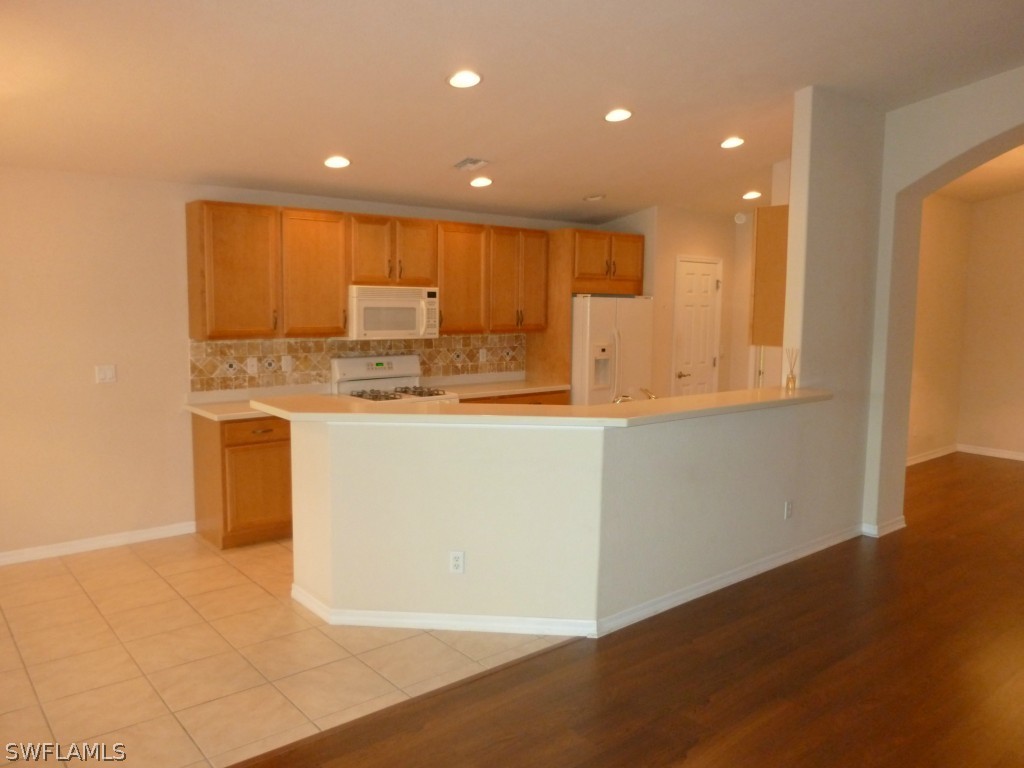 19744 Villa Rosa Loop Fort Myers, FL 33967 - Photo 4 of 14 a view of kitchen with wooden floor