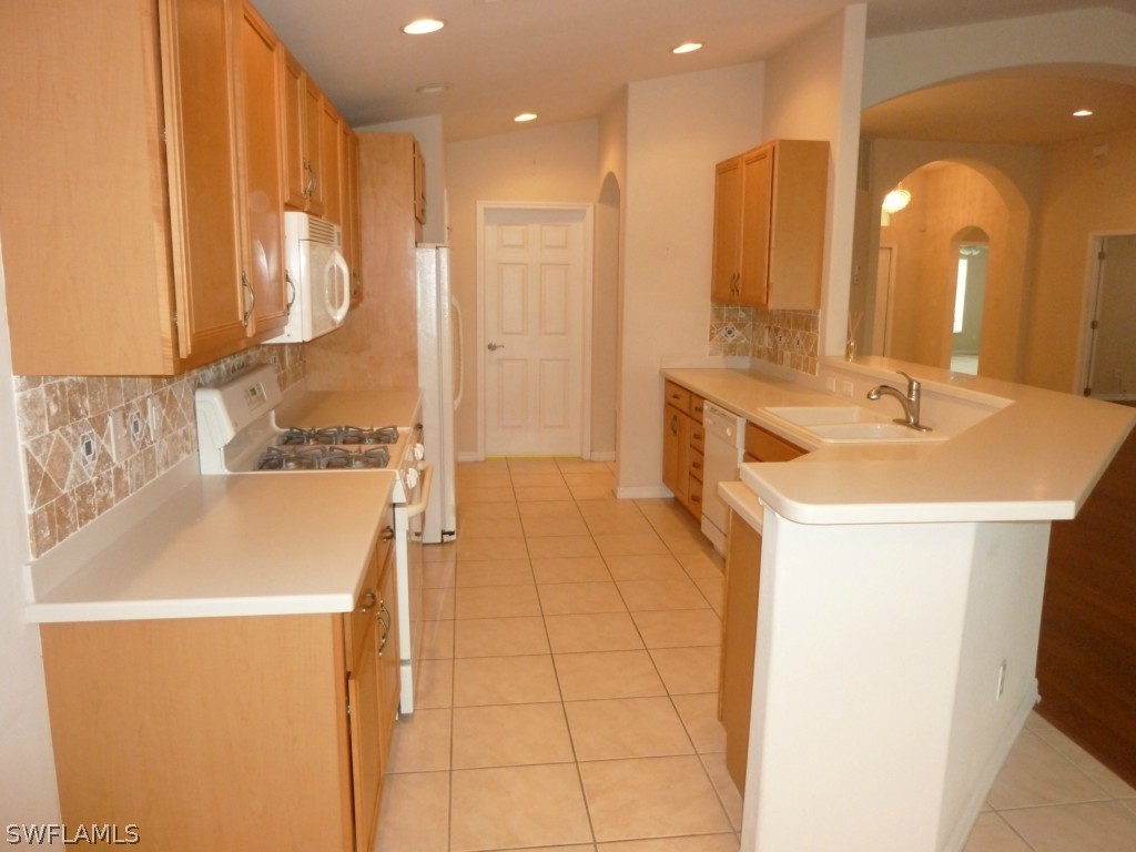 19744 Villa Rosa Loop Fort Myers, FL 33967 - Photo 5 of 14 a bathroom with a sink a tub and a mirror