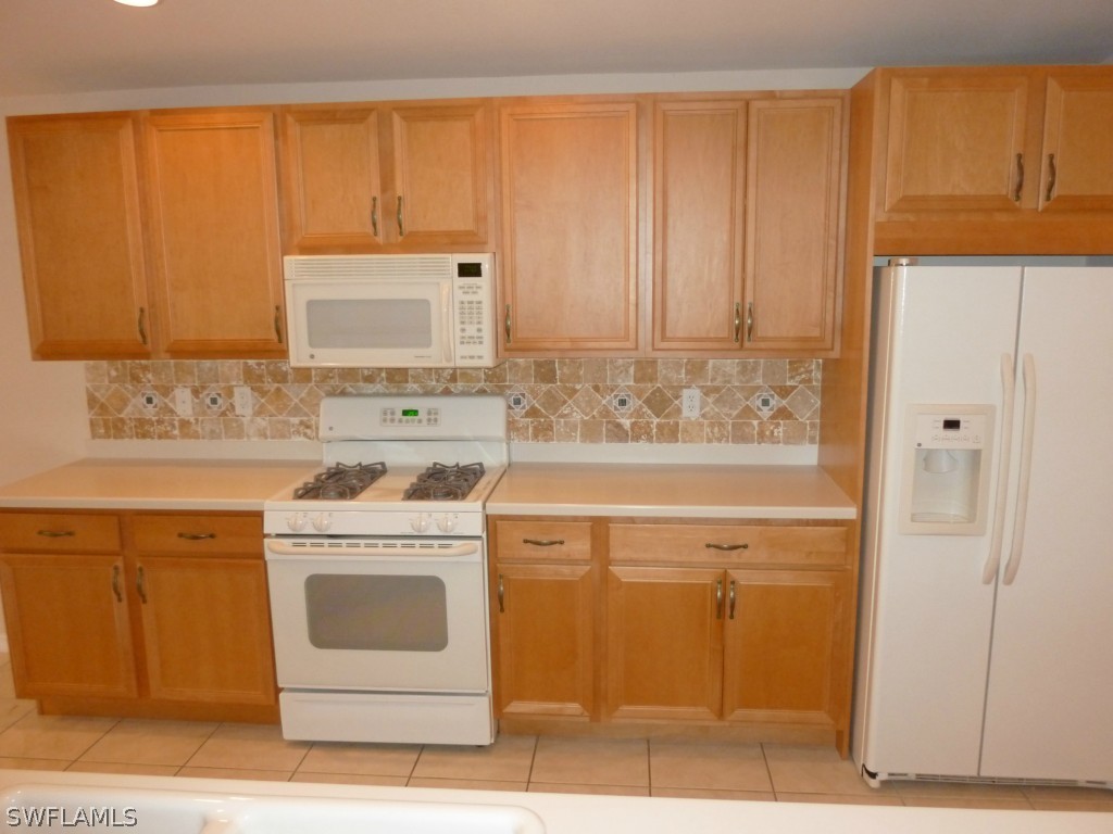 19744 Villa Rosa Loop Fort Myers, FL 33967 - Photo 6 of 14 a view of a kitchen with sink washer and dryer