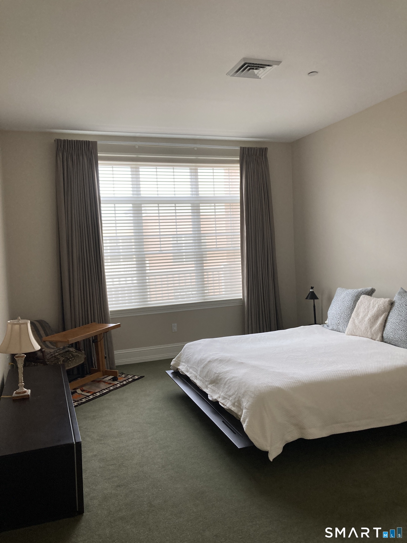 75 Stone Ridge Way, Unit 3A Fairfield, CT 06824 - Photo 13 of 27 a bedroom with a bed and window