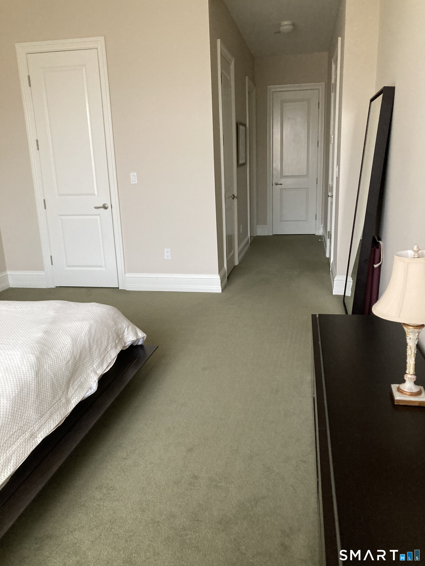 75 Stone Ridge Way, Unit 3A Fairfield, CT 06824 - Photo 14 of 27 a bed sitting in a bedroom next to a window