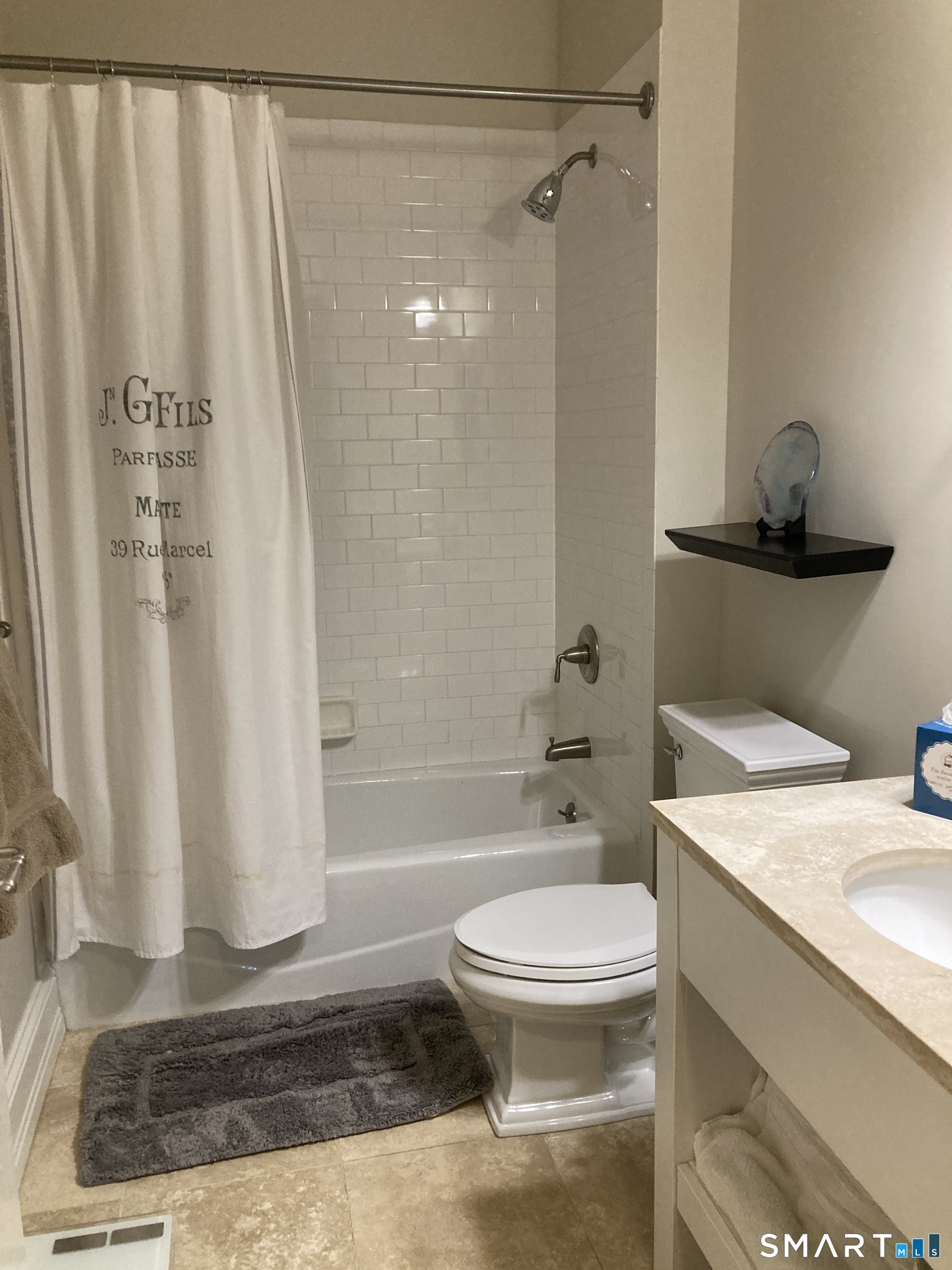 75 Stone Ridge Way, Unit 3A Fairfield, CT 06824 - Photo 17 of 27 a bathroom with a sink a toilet and shower