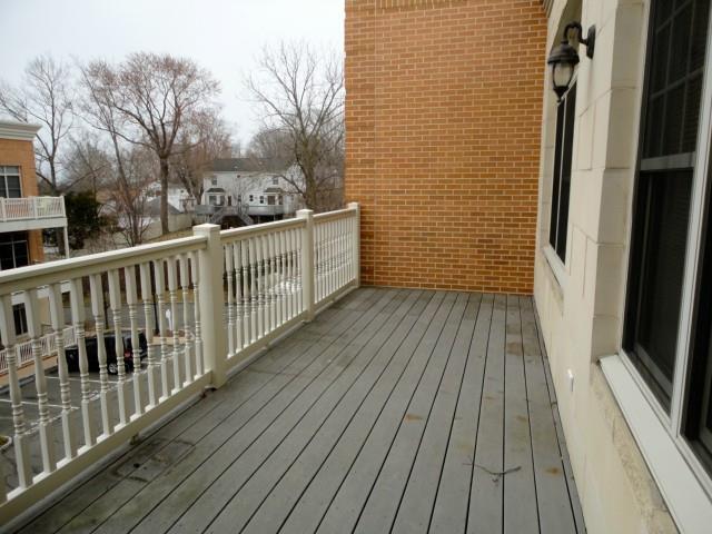 75 Stone Ridge Way, Unit 3A Fairfield, CT 06824 - Photo 20 of 27 a view of a balcony with wooden floor