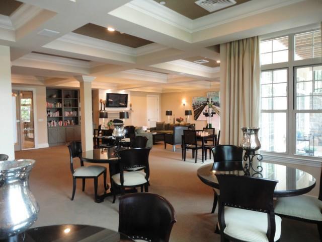 75 Stone Ridge Way, Unit 3A Fairfield, CT 06824 - Photo 22 of 27 a living room with furniture and large windows