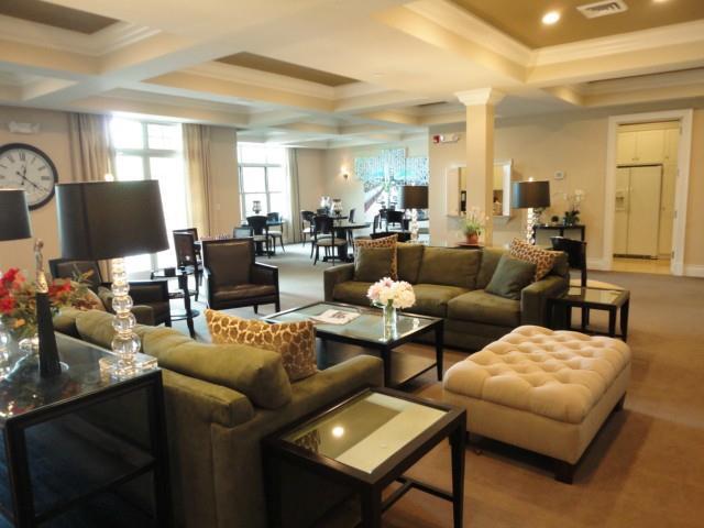 75 Stone Ridge Way, Unit 3A Fairfield, CT 06824 - Photo 23 of 27 a living room with furniture and a flat screen tv