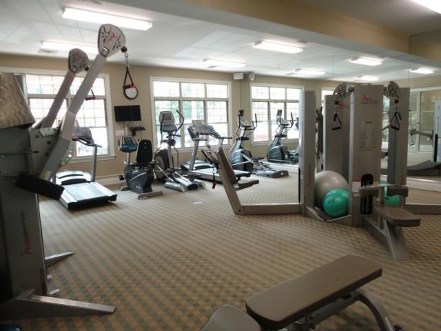 75 Stone Ridge Way, Unit 3A Fairfield, CT 06824 - Photo 24 of 27 a view of a room with gym equipment