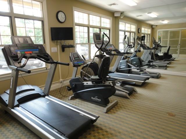 75 Stone Ridge Way, Unit 3A Fairfield, CT 06824 - Photo 25 of 27 a view of a room with gym equipment