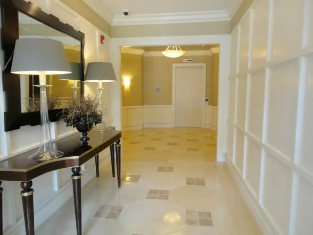 a bathroom with a granite countertop sink a mirror and a shower