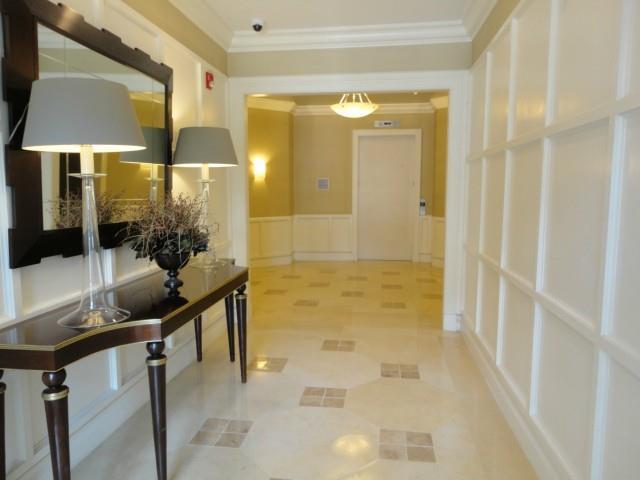 75 Stone Ridge Way, Unit 3A Fairfield, CT 06824 - Photo 3 of 27 a bathroom with a granite countertop sink a mirror and a shower