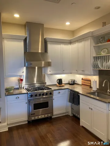 a kitchen with a stove and a sink