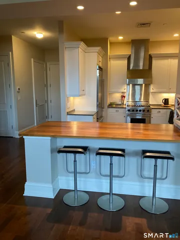 a kitchen with stainless steel appliances granite countertop a sink and a cabinets