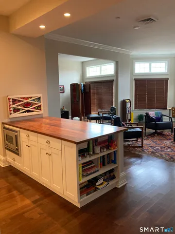 a kitchen with stainless steel appliances a stove a sink and a refrigerator