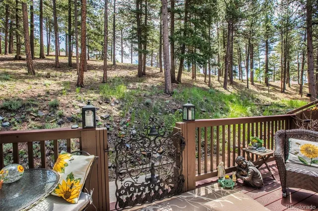 a view of a chairs and table in the balcony