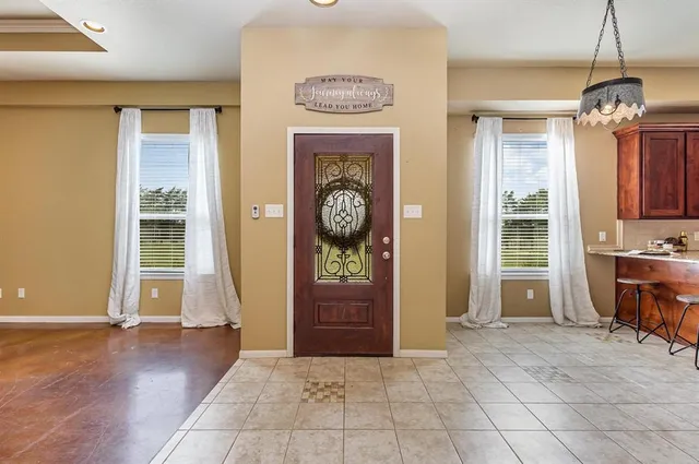 a view of an entryway with a chandelier