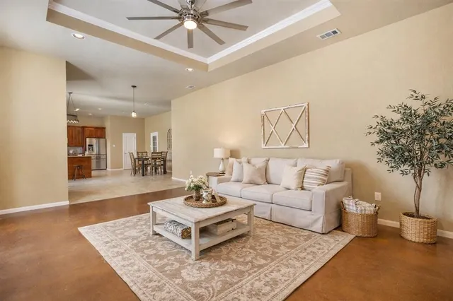 a living room with furniture and a table