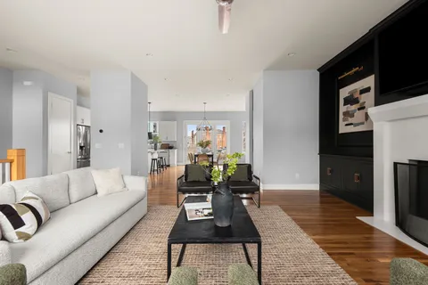 a living room with furniture and a rug
