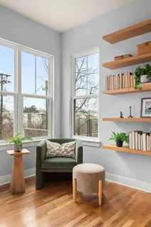 a view of staircase with railing and white walls