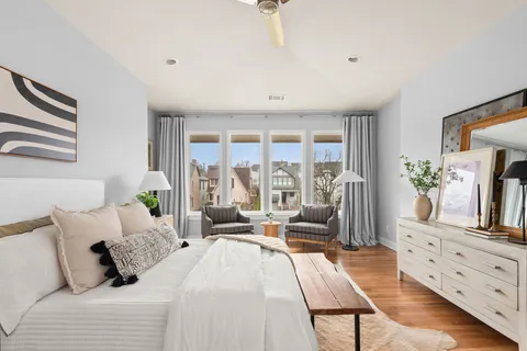 a bedroom with a bed and a couch