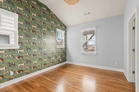 a bathroom with a sink double vanity and a mirror