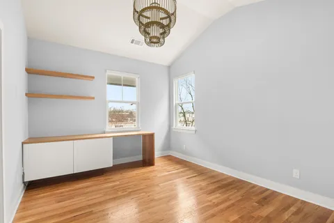 a room with furniture and view of living room