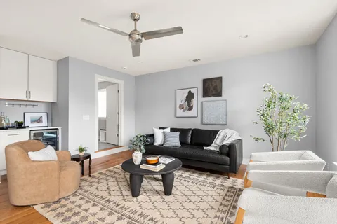 a bathroom with a shower sink vanity and mirror