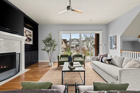 a living room with furniture fireplace and flat screen tv