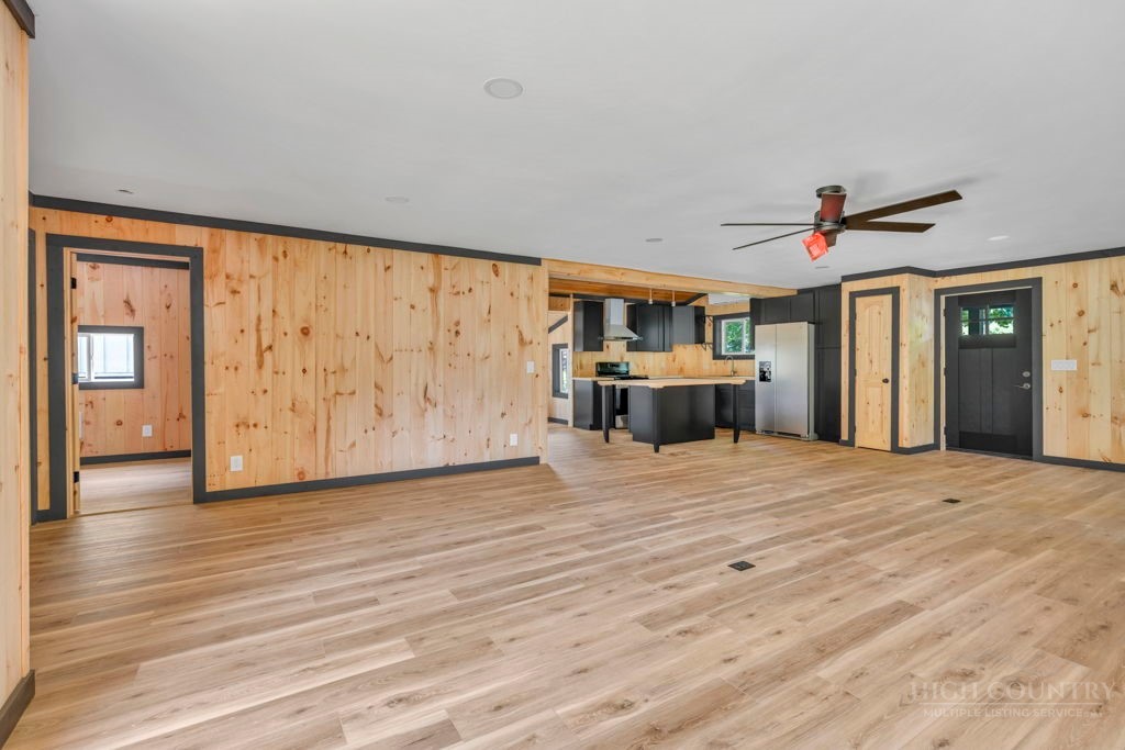 209 Meadow Loop Newland, NC 28657 - Photo 7 of 30 a view of empty room with wooden floor and fan