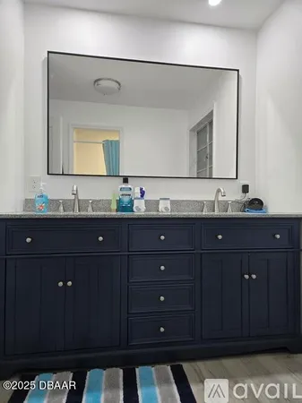 a room with a dresser and a mirror