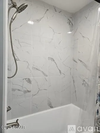 a bathroom with a sink vanity and mirror