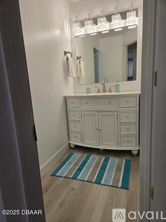a utility room with sink dryer and washer