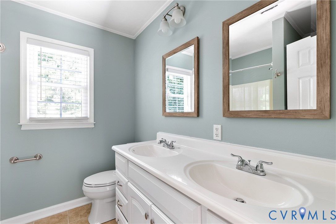 3114 Shiloh Church Road Midlothian, VA 23112 - Photo 22 of 34 Dual-sink vanity with white porcelain basins and p