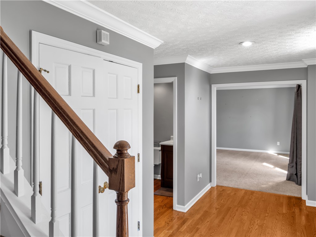 25 Callaway Springboro, OH 45066 - Photo 19 of 51 This inviting entryway features rich wood flooring, crisp crown molding, and a seamless flow into adjoining rooms.