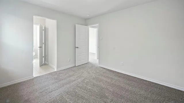 a view of an empty room and closet area