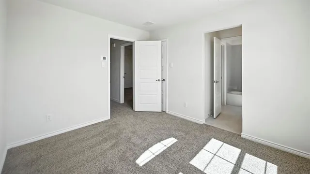 a view of livingroom with an empty space and window