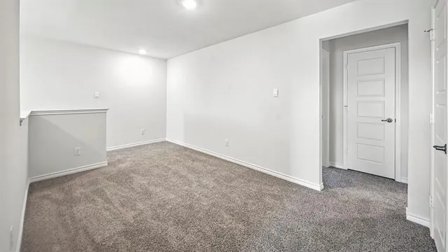 an empty room with closet area