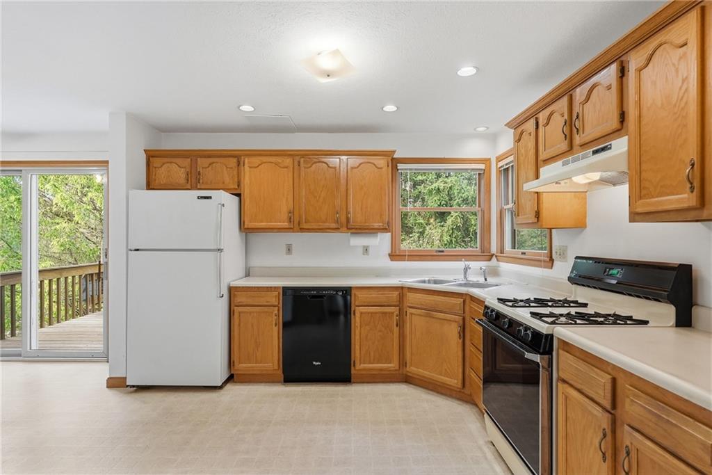 114 Sika Drive Pittsburgh, PA 15239 - Photo 15 of 45 a kitchen with sink a refrigerator and white cabinets