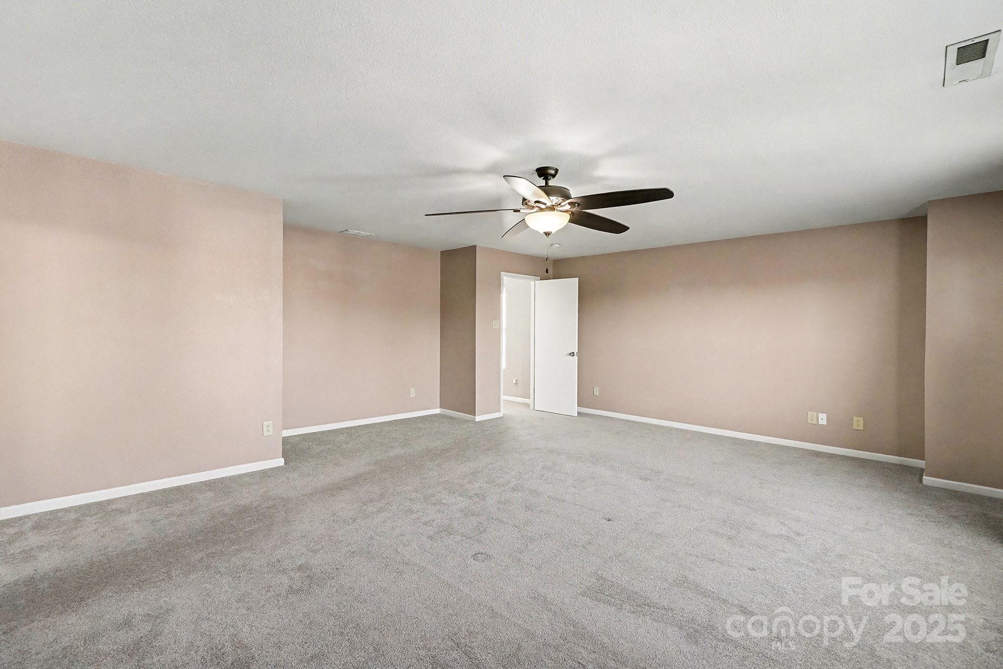 3901 Shasta Circle Clover, SC 29710 - Photo 18 of 36 a view of an empty room with a chandelier fan