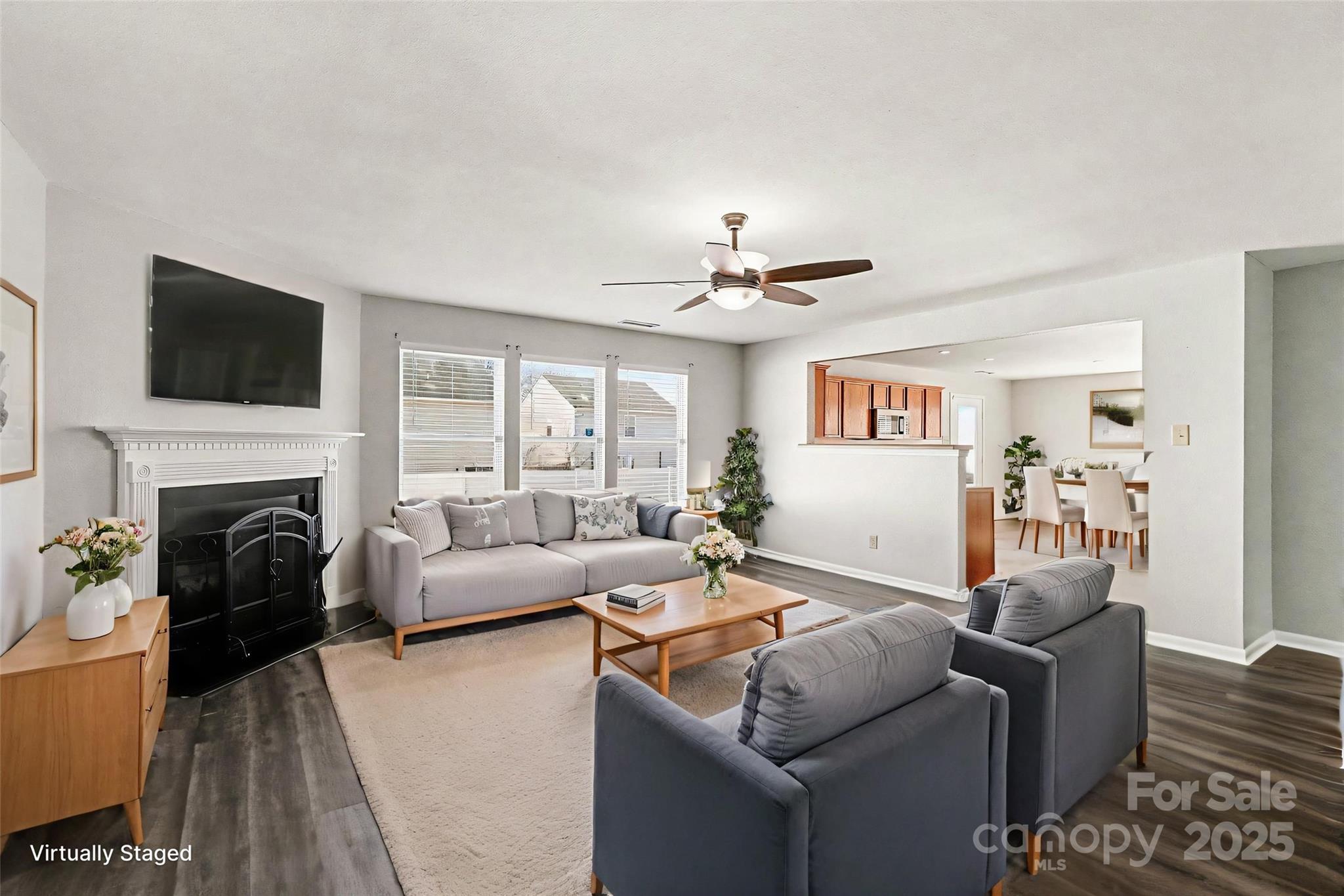 3901 Shasta Circle Clover, SC 29710 - Photo 7 of 36 a living room with furniture a fireplace and a flat screen tv