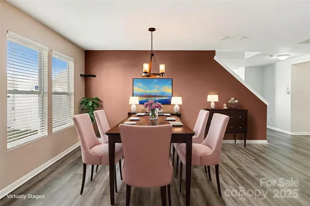 a dining room with furniture and window