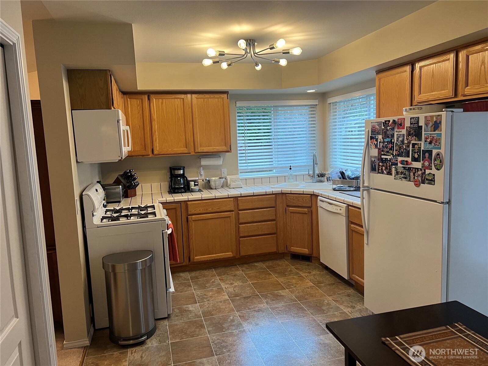 4006 Peters Lane Anacortes, WA 98221 - Photo 9 of 10 a kitchen with a sink cabinets and window