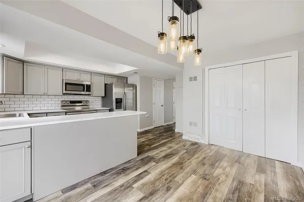 a view of a dining room with furniture and wooden floor