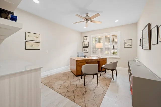 a view of a dining room with furniture and window