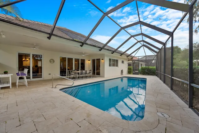 a view of swimming pool with seating area