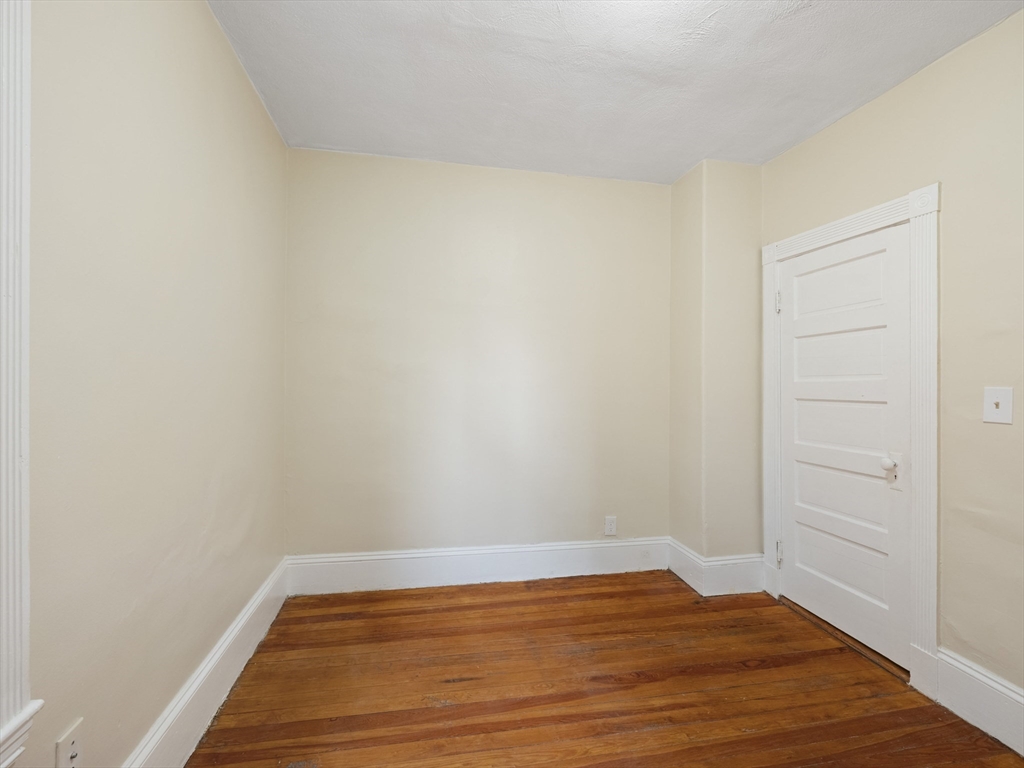 75 Bellingham Street Chelsea, MA 02150 - Photo 26 of 42 a view of room with wooden floor