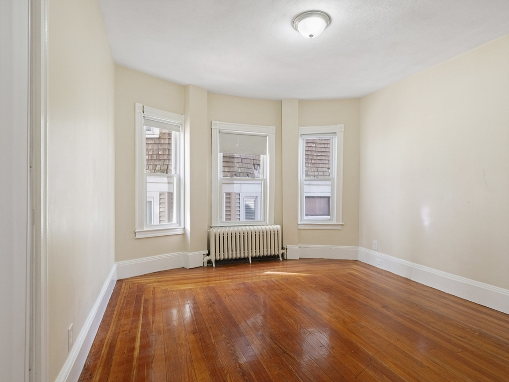 75 Bellingham Street Chelsea, MA 02150 - Photo 8 of 42 an empty room with a window
