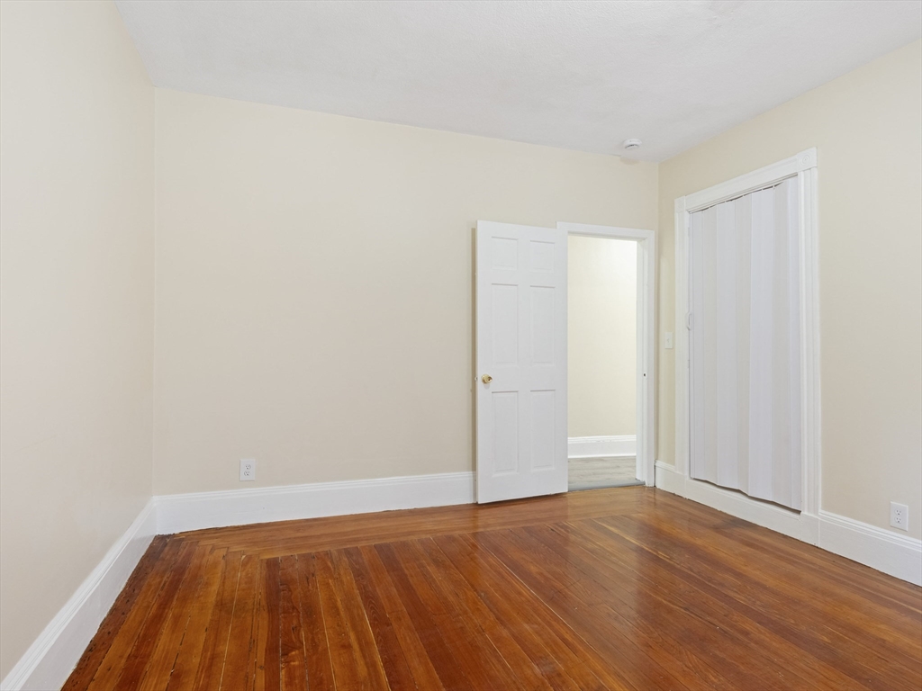 75 Bellingham Street Chelsea, MA 02150 - Photo 9 of 42 a view of room with wooden floor