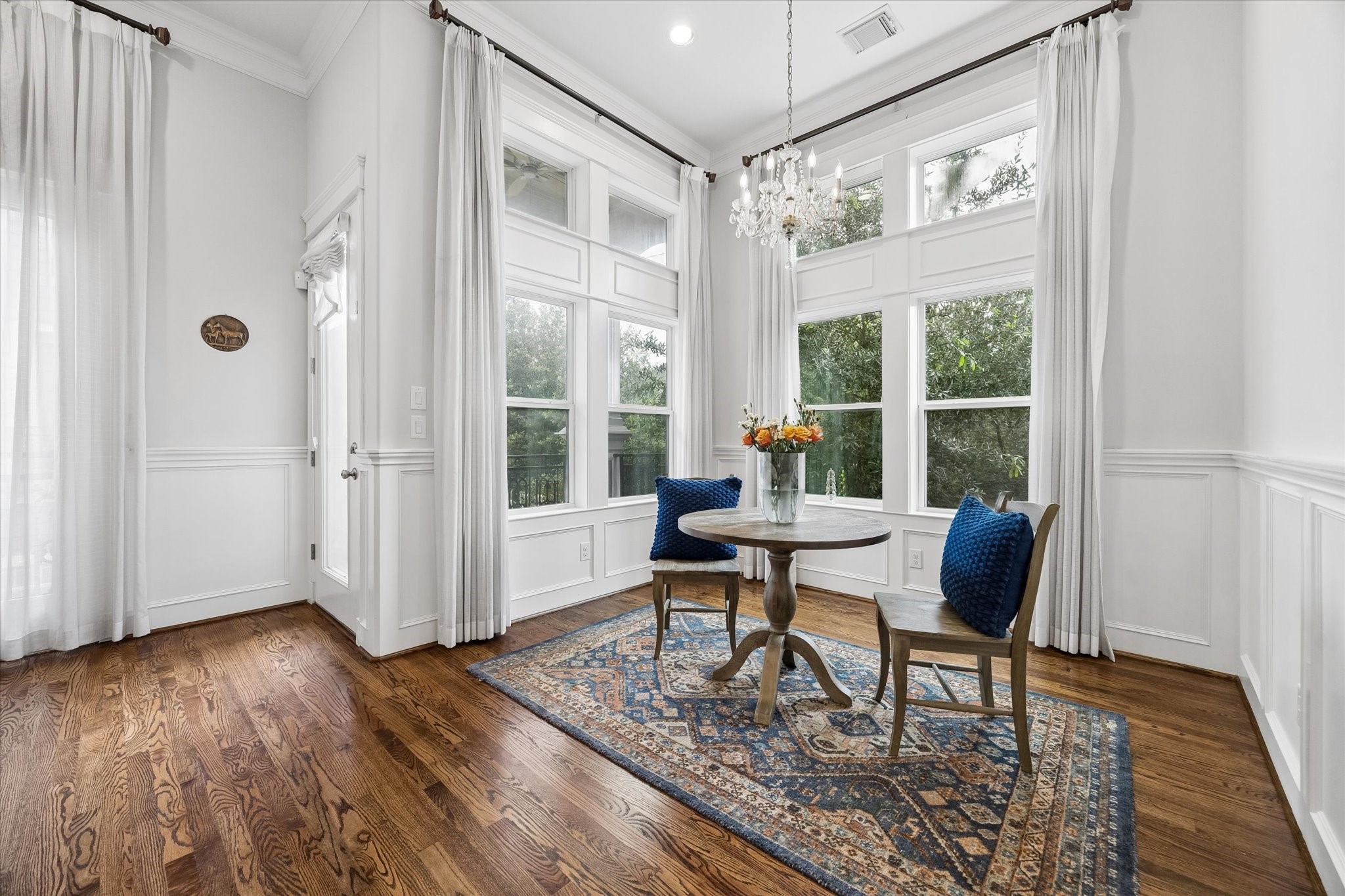 609 Rutland Street, Unit A Houston, TX 77007 - Photo 8 of 30 a work room with wooden floor and a table