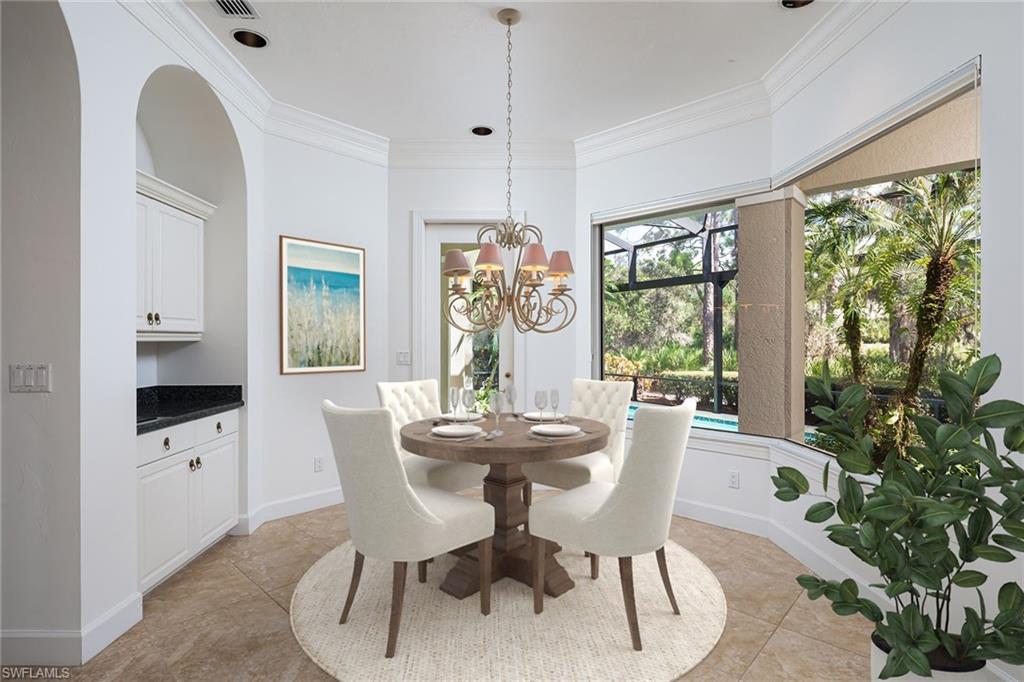 896 Barcarmil Way Naples, FL 34110 - Photo 14 of 45 a dining room with furniture a chandelier and window