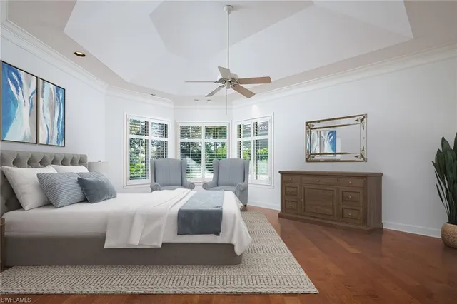 a living room with furniture large window and a table